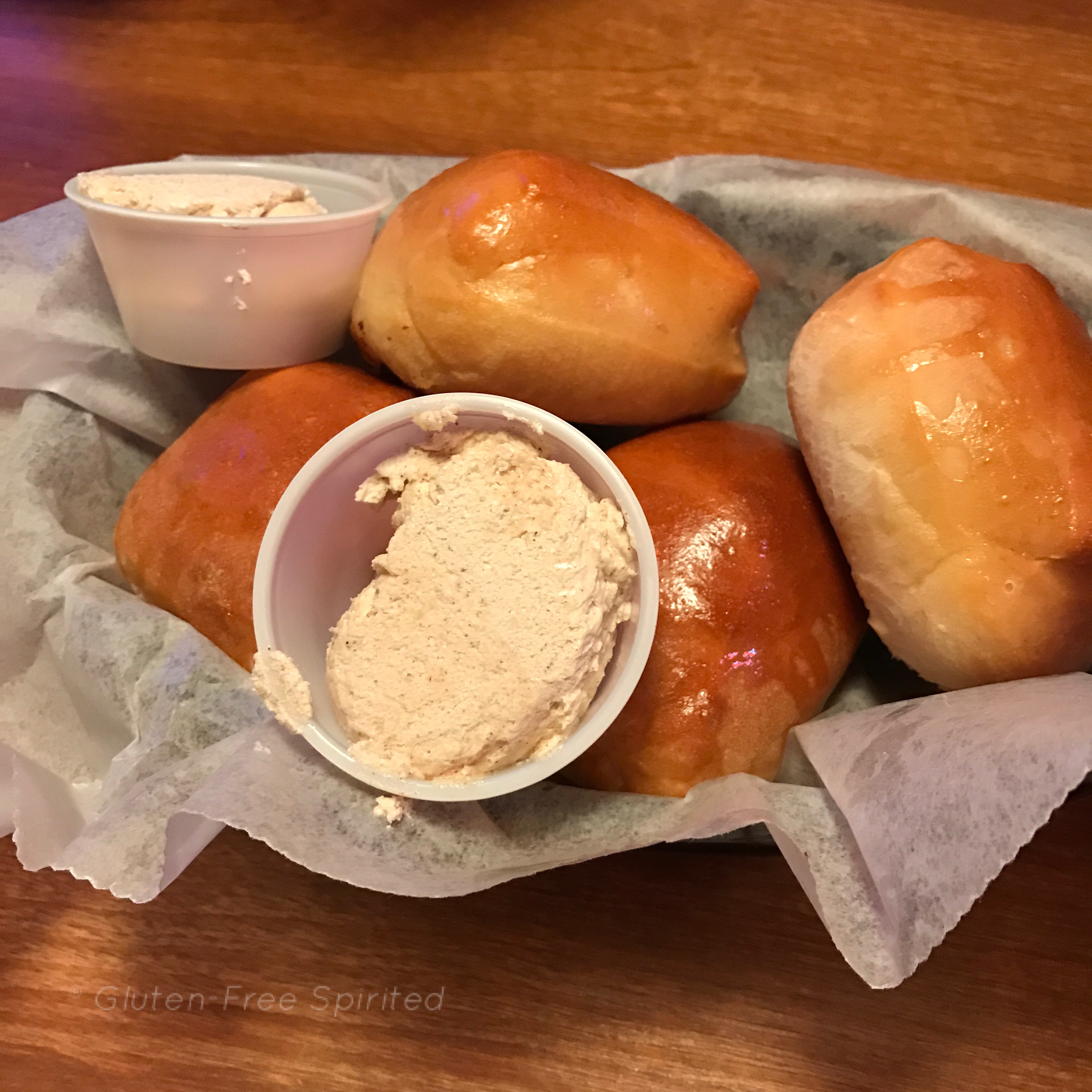 An image of dinner rolls & cinnamon butter from Texas Roadhouse.