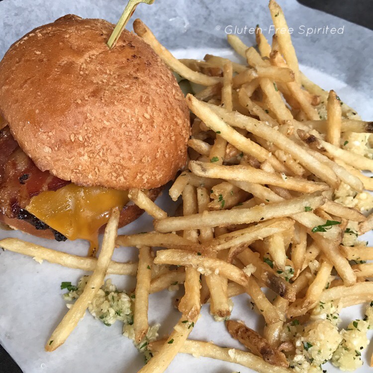 A picture of a BBQ Bacon cheesburger and shoestring garlic fries.