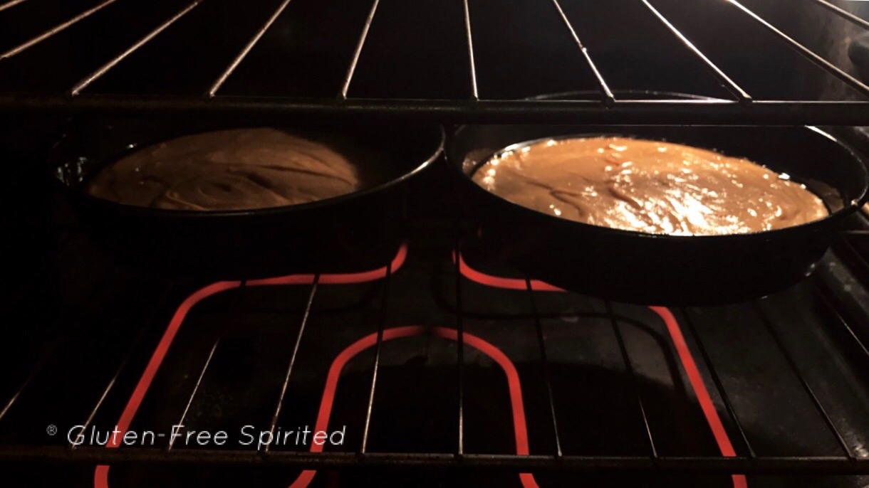 A picture of two cakes in 9" inch pans in the oven.