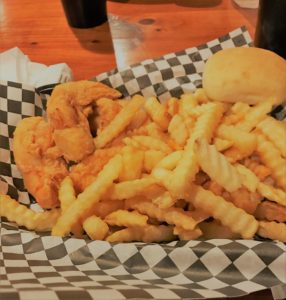 Chicken Tender basket with fries & a roll.