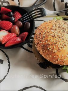 Hamburger with gluten-free bun and a side of fruit