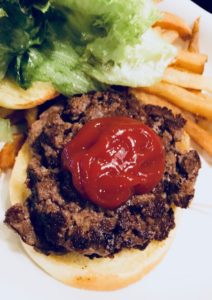 hamburger with lettuce and ketchup