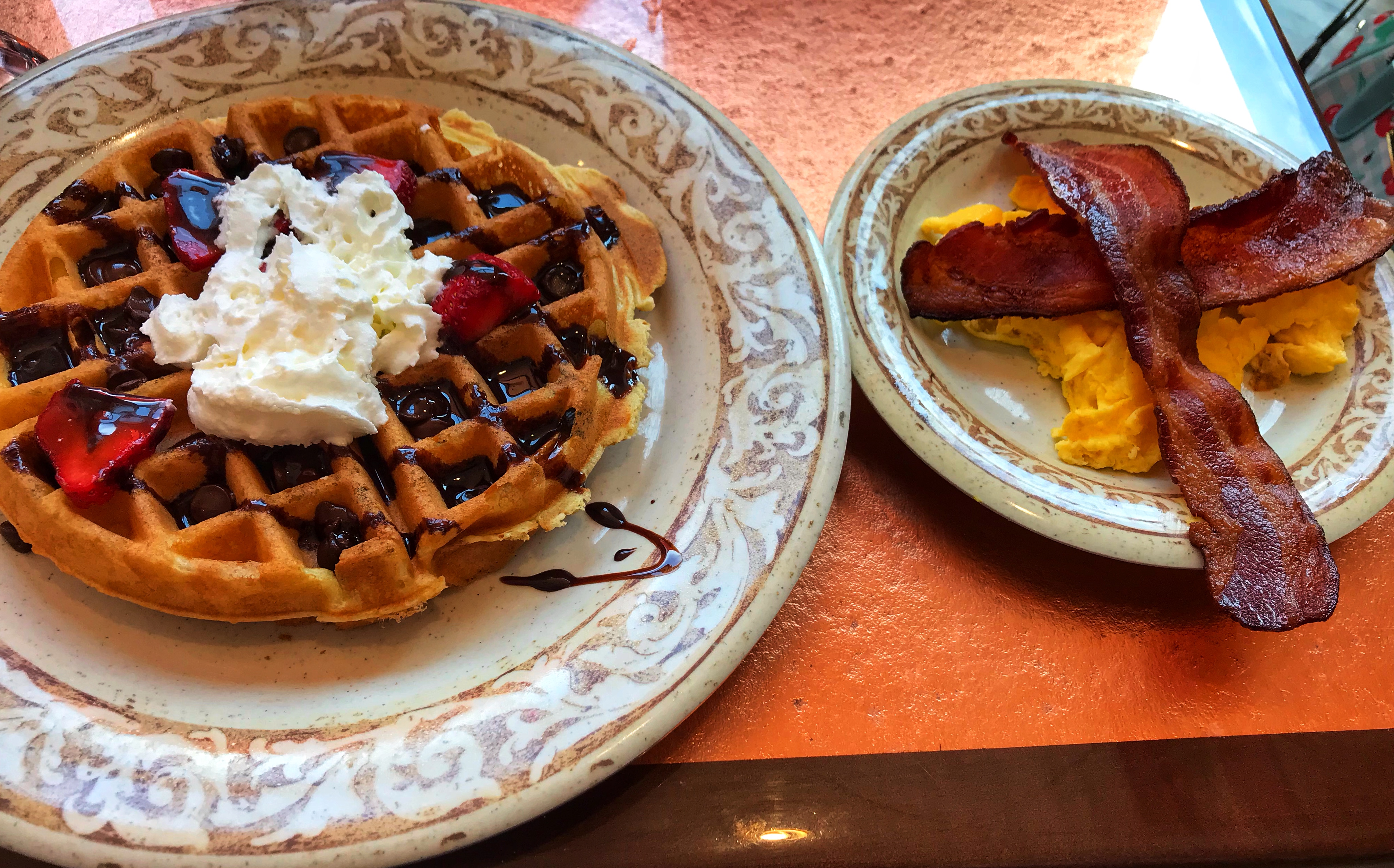 Belgian waffles, bacon, eggs from Another Broken Egg Cafe