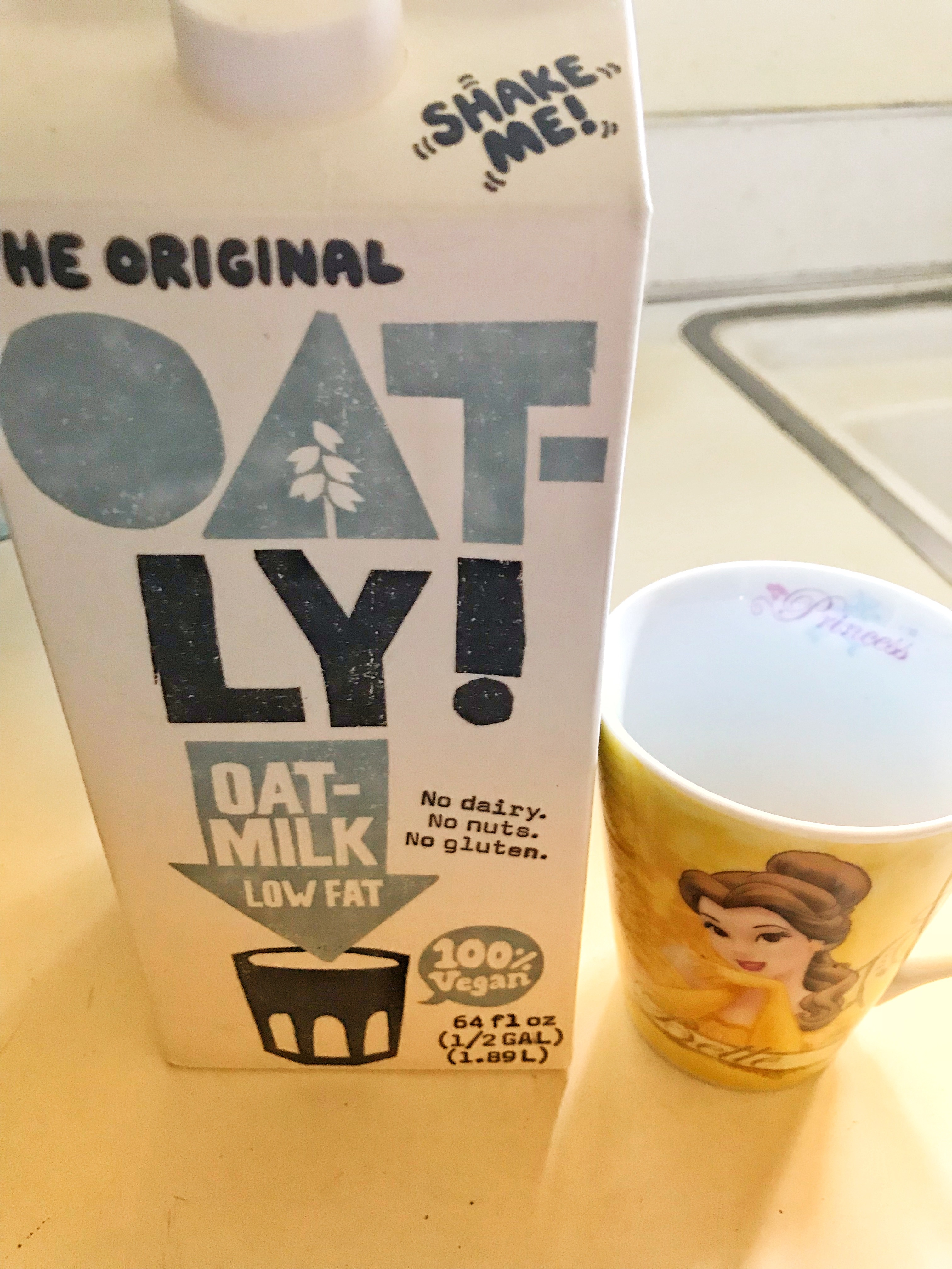 Oatly Oat Milk carton and mug